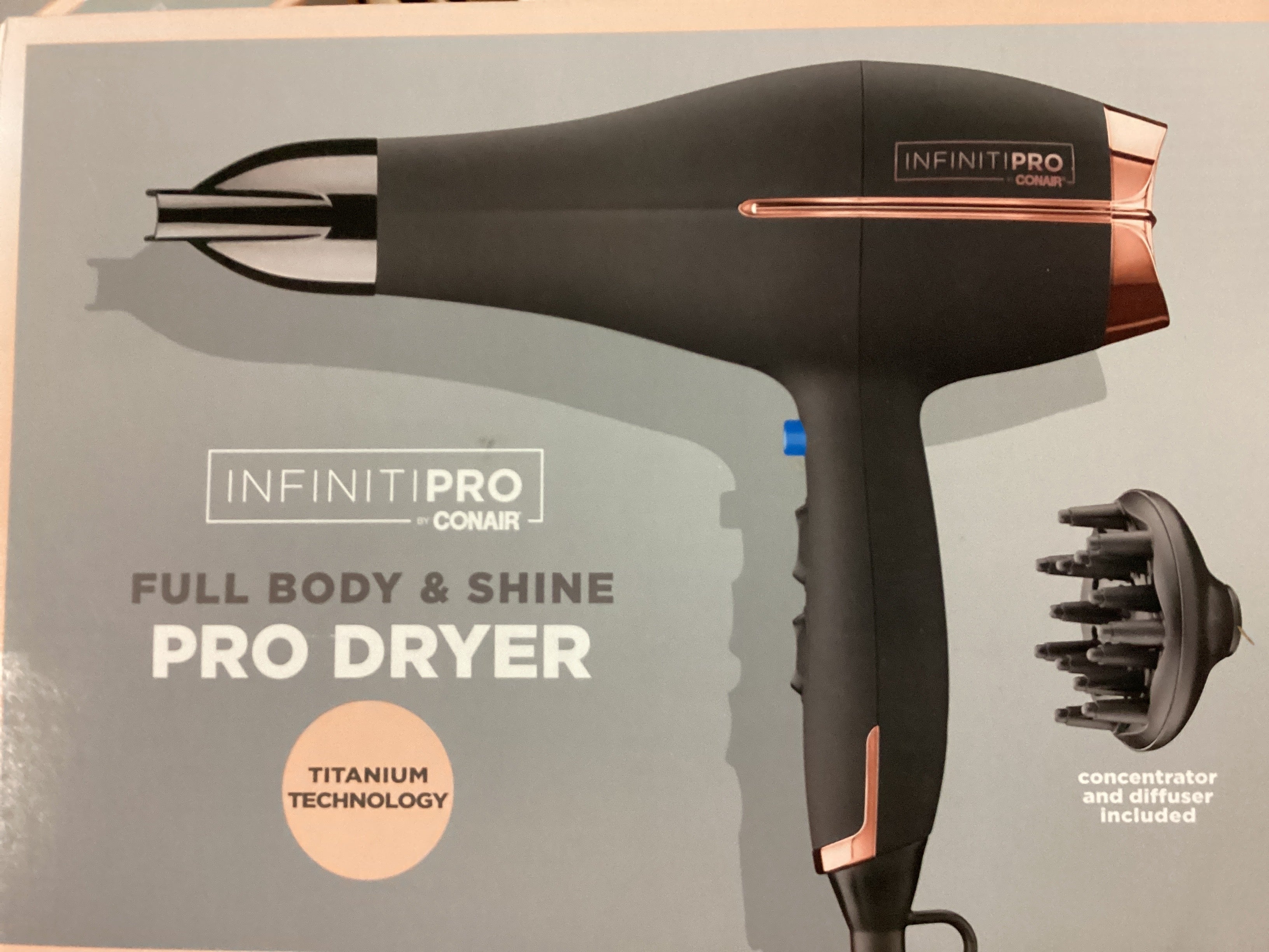 InfinitiPro by Conair hair dryer with concentrator and diffuser on a gray background