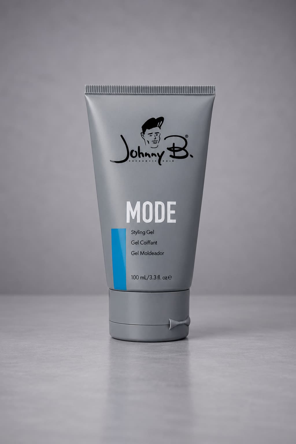 Tube of Johnny B. Mode styling gel on a gray background