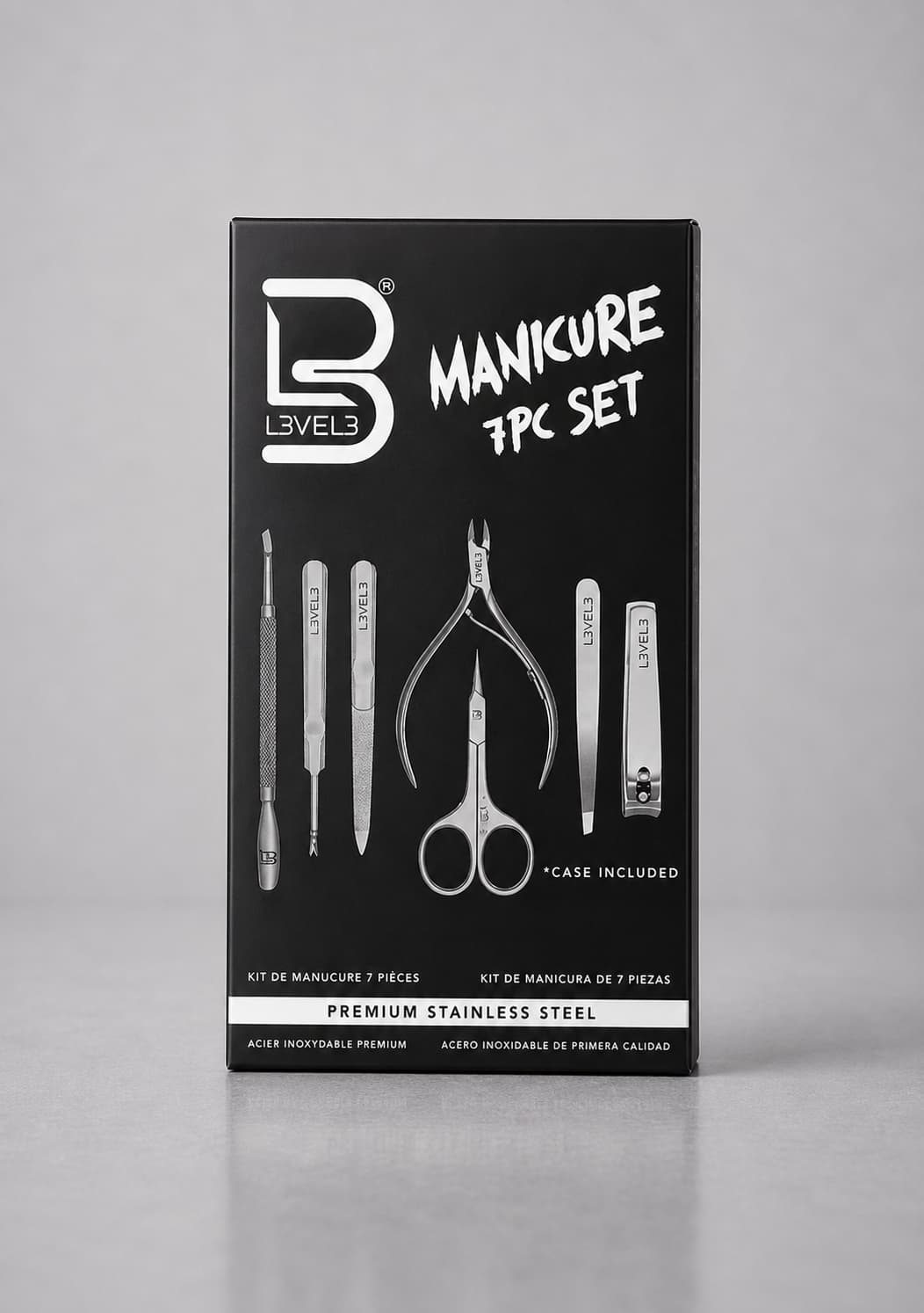 Manicure set packaging with tools on a gray background
