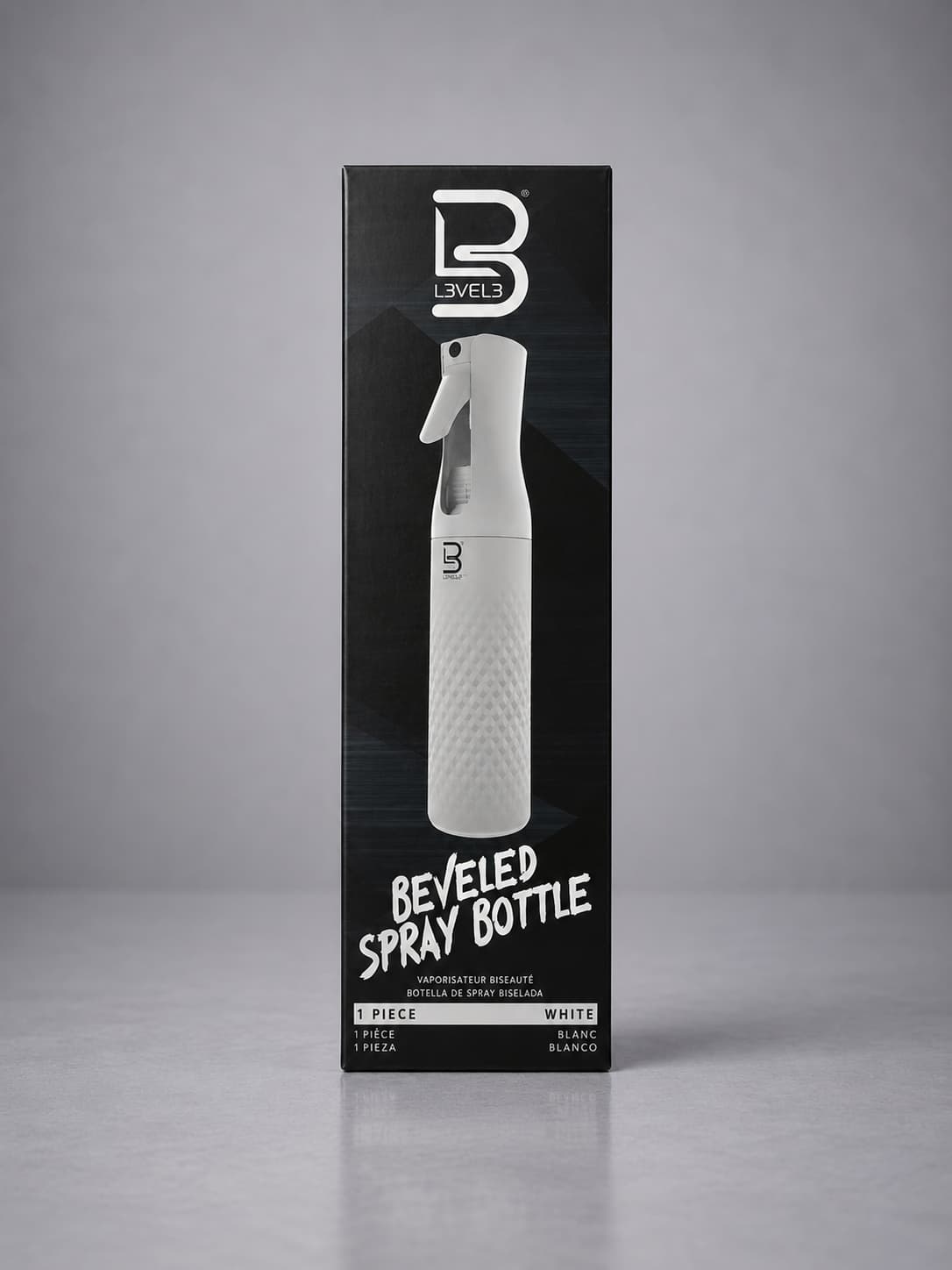 Beveled spray bottle packaging on a gray background