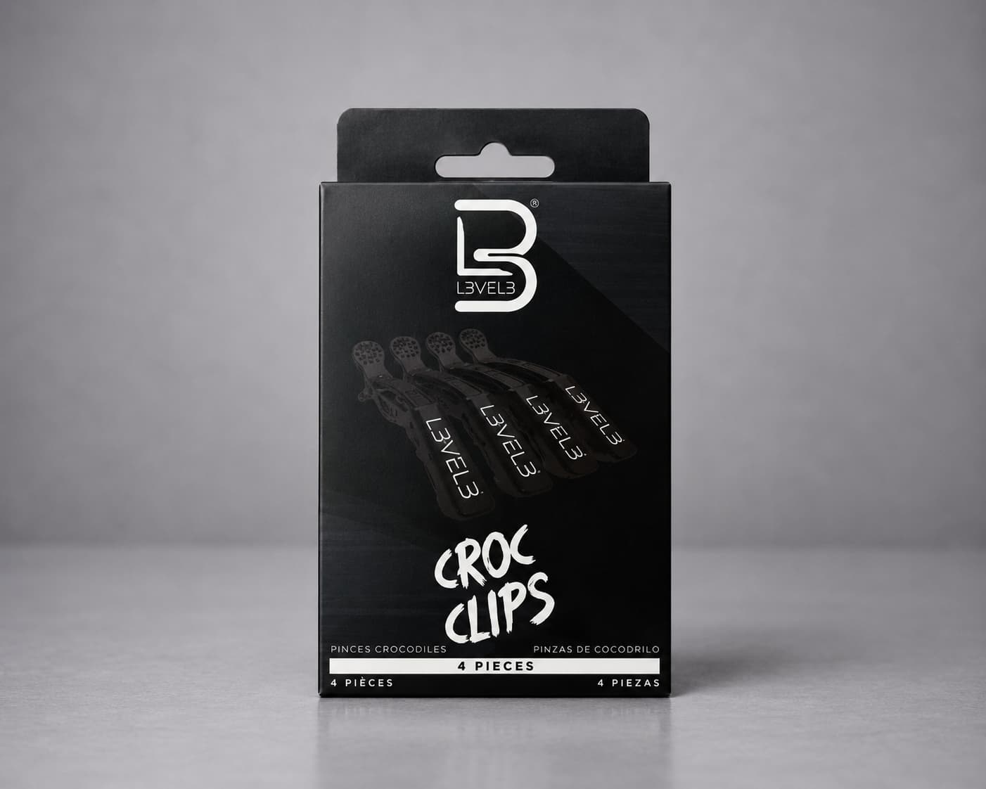Packaging of Level3 Croc Clips on a gray background