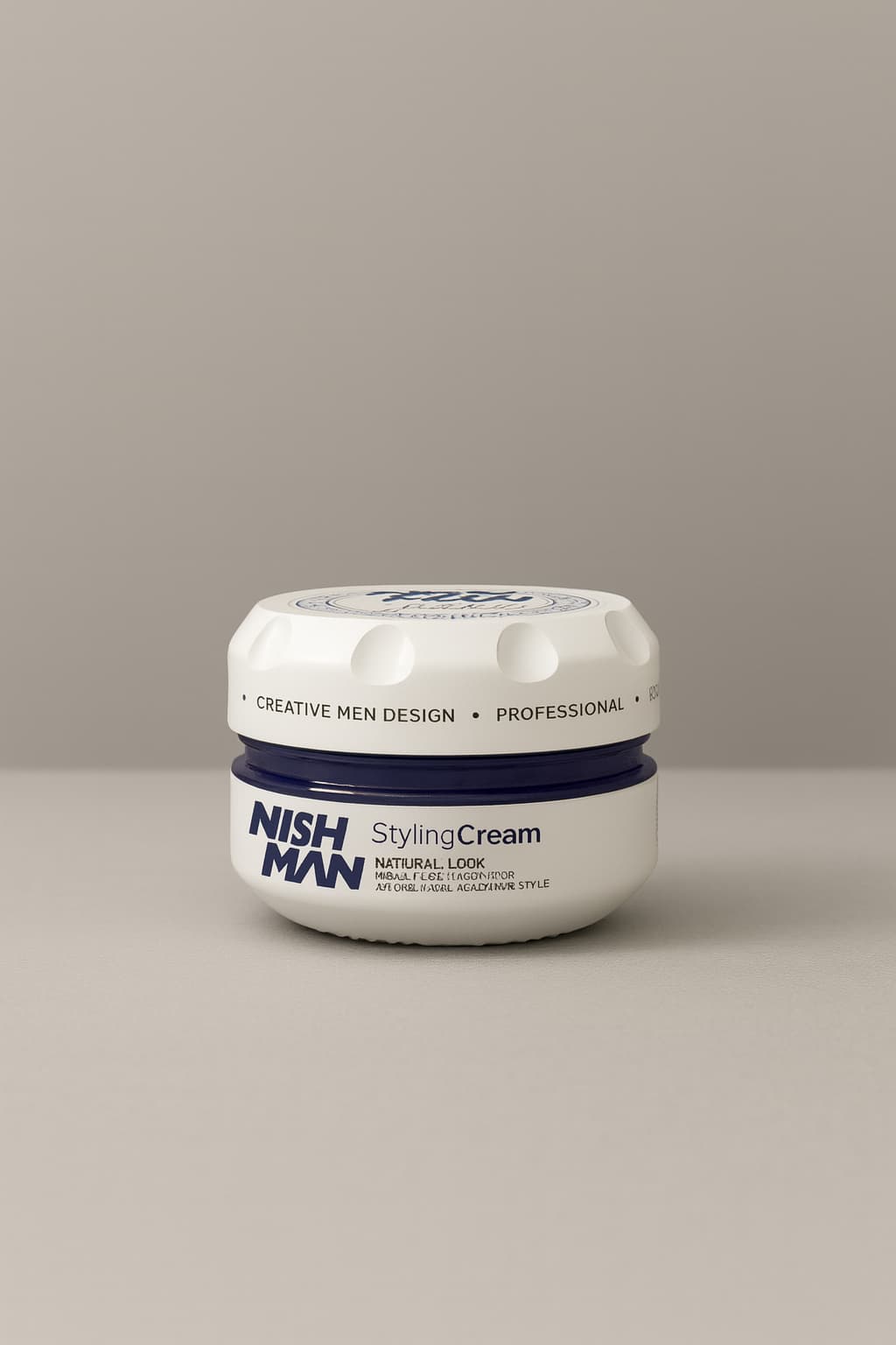 Jar of Nish Man Styling Cream on a beige background