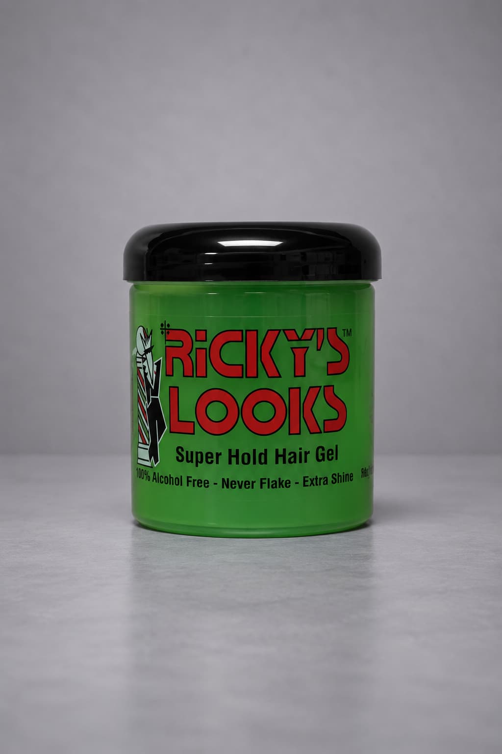 Green jar of Ricky's Looks Super Hold Hair Gel with a black lid on a gray background