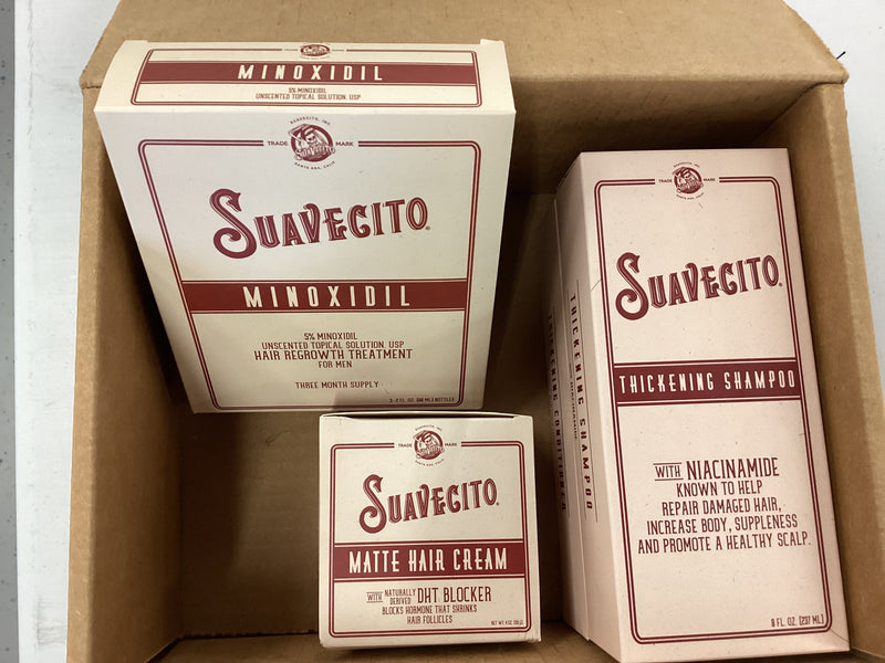 Three Suavecito hair care product boxes in a cardboard box.
